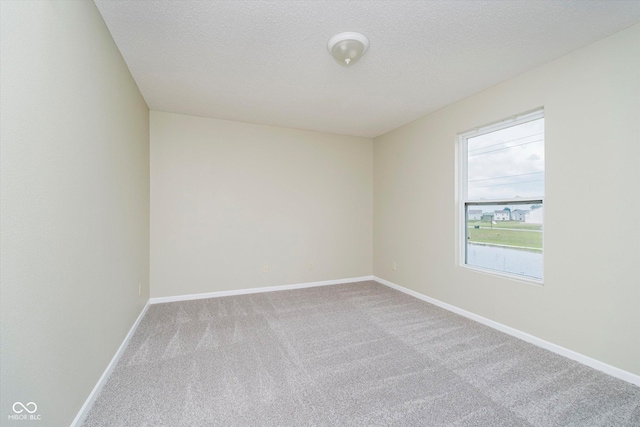2834 Wolfgang Dr, Indianapolis, IN 46239 - carpeted empty room with baseboards and a textured ceiling