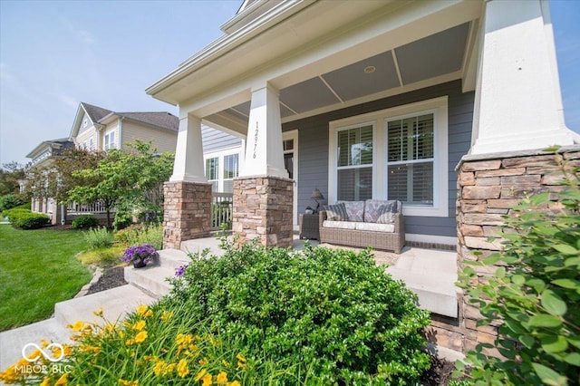 12976 Walbeck Dr, Fishers, IN 46037 - doorway to property featuring a porch and a yard