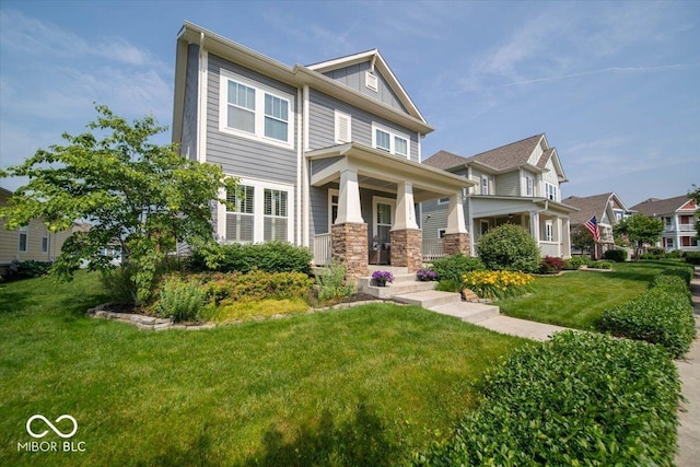 12976 Walbeck Dr, Fishers, IN 46037 - view of front of home featuring covered porch, a front lawn, board and batten siding, and stone siding