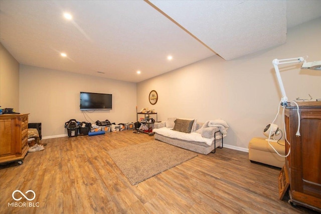 12976 Walbeck Dr, Fishers, IN 46037 - living room featuring wood finished floors and recessed lighting