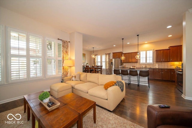 12976 Walbeck Dr, Fishers, IN 46037 - living area featuring dark wood-style floors and recessed lighting