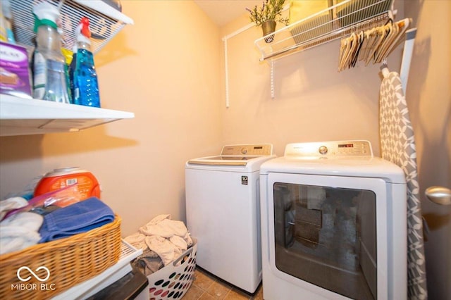 12976 Walbeck Dr, Fishers, IN 46037 - washroom featuring washing machine and dryer and tile patterned floors