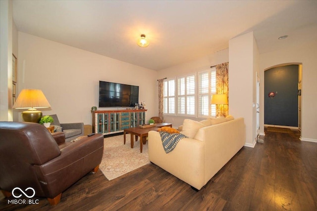 12976 Walbeck Dr, Fishers, IN 46037 - living room featuring arched walkways and dark wood-style floors