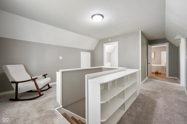 110 E Harrison St, Spiceland, IN 47346 - hallway featuring carpet floors, lofted ceiling, and an upstairs landing