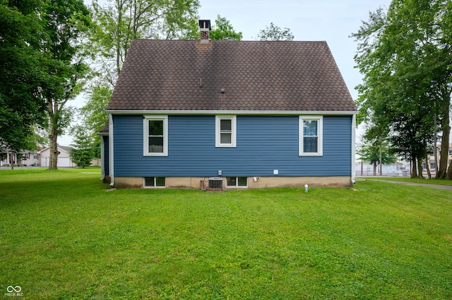 110 E Harrison St, Spiceland, IN 47346 - rear view of house featuring a chimney and a lawn