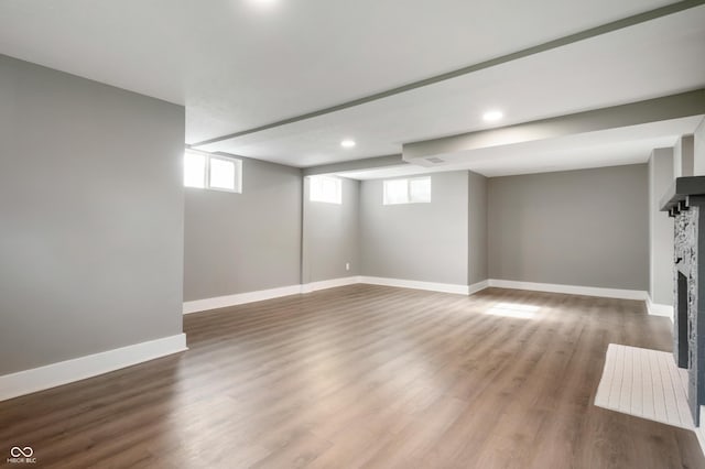 110 E Harrison St, Spiceland, IN 47346 - below grade area with wood finished floors, recessed lighting, and a fireplace