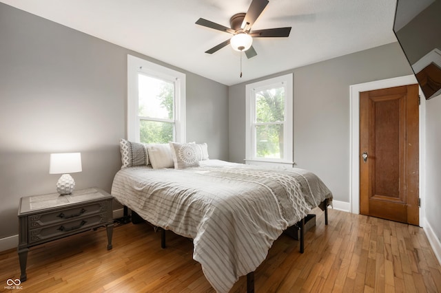 110 E Harrison St, Spiceland, IN 47346 - bedroom featuring light wood-type flooring and a ceiling fan