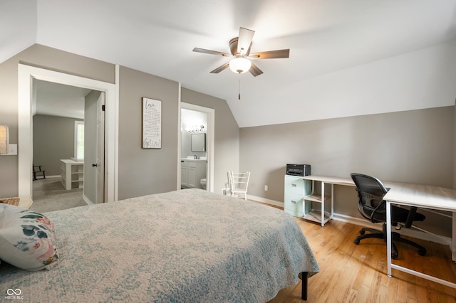 110 E Harrison St, Spiceland, IN 47346 - bedroom featuring lofted ceiling, a desk, wood finished floors, a ceiling fan, and ensuite bathroom
