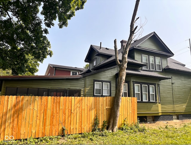 624 N Rural St, Indianapolis, IN 46201 - view of side of home with a chimney