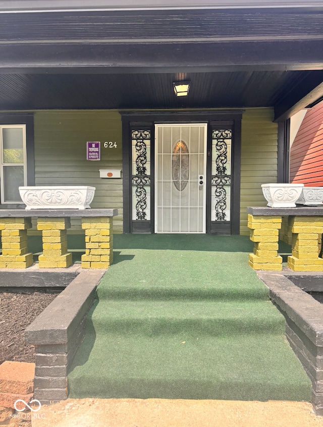 624 N Rural St, Indianapolis, IN 46201 - view of exterior entry featuring covered porch