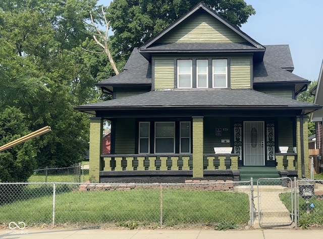 624 N Rural St, Indianapolis, IN 46201 - view of front of home featuring covered porch, roof with shingles, and a gate