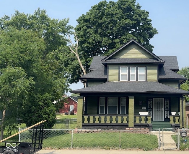 624 N Rural St, Indianapolis, IN 46201 - view of front of property with a porch, roof with shingles, and a gate