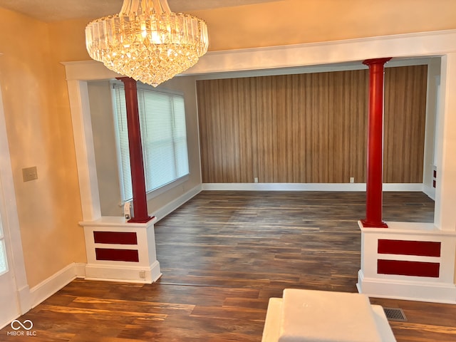 624 N Rural St, Indianapolis, IN 46201 - unfurnished room with wood finished floors, a chandelier, and baseboards