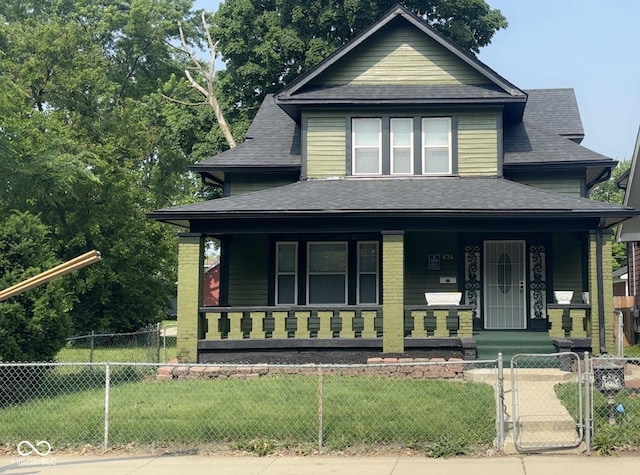 624 N Rural St, Indianapolis, IN 46201 - view of front facade with a porch, a shingled roof, and a gate