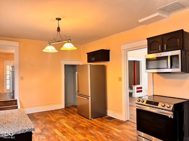 624 N Rural St, Indianapolis, IN 46201 - kitchen with appliances with stainless steel finishes, dark wood-type flooring, pendant lighting, and baseboards