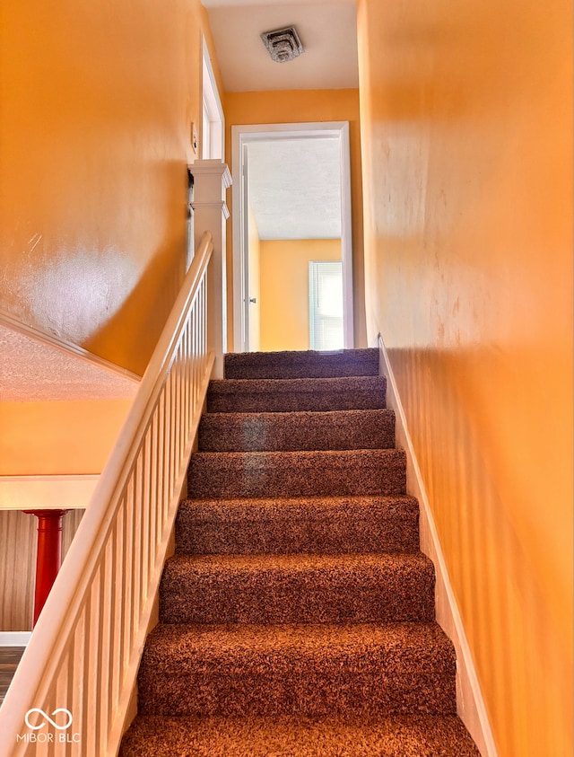 624 N Rural St, Indianapolis, IN 46201 - stairs with baseboards