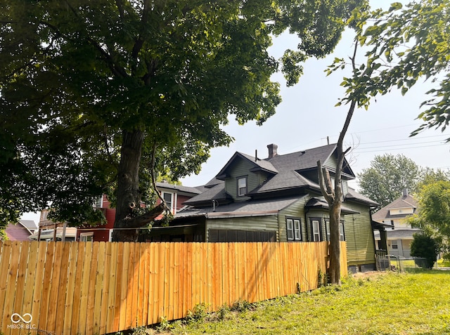 624 N Rural St, Indianapolis, IN 46201 - rear view of property featuring roof with shingles