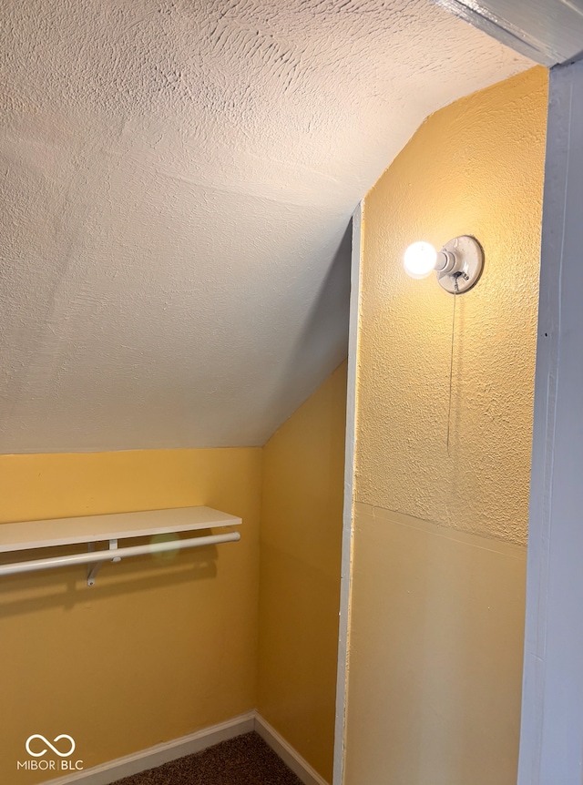 624 N Rural St, Indianapolis, IN 46201 - bonus room featuring lofted ceiling, a textured ceiling, baseboards, and carpet flooring