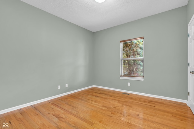 2948 Chalbury Dr, Plainfield, IN 46168 - unfurnished room featuring light wood finished floors and a textured ceiling