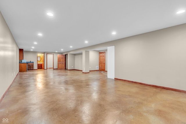 2948 Chalbury Dr, Plainfield, IN 46168 - unfurnished living room featuring finished concrete flooring and recessed lighting