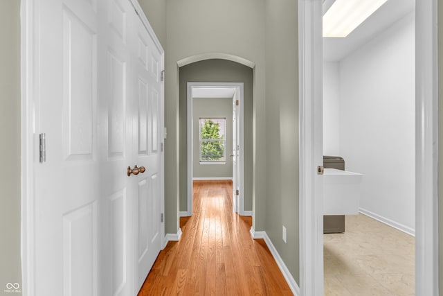 2948 Chalbury Dr, Plainfield, IN 46168 - hallway featuring arched walkways and light wood finished floors