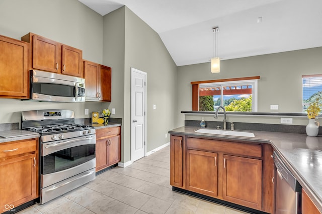 2948 Chalbury Dr, Plainfield, IN 46168 - kitchen with appliances with stainless steel finishes, light tile patterned flooring, plenty of natural light, brown cabinetry, and high vaulted ceiling