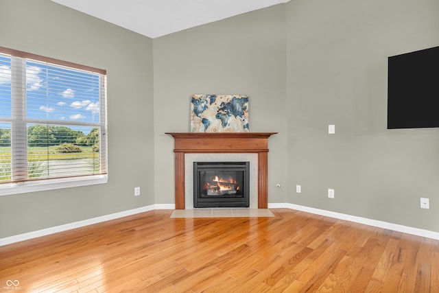 2948 Chalbury Dr, Plainfield, IN 46168 - unfurnished living room featuring light wood-style floors and a fireplace with flush hearth