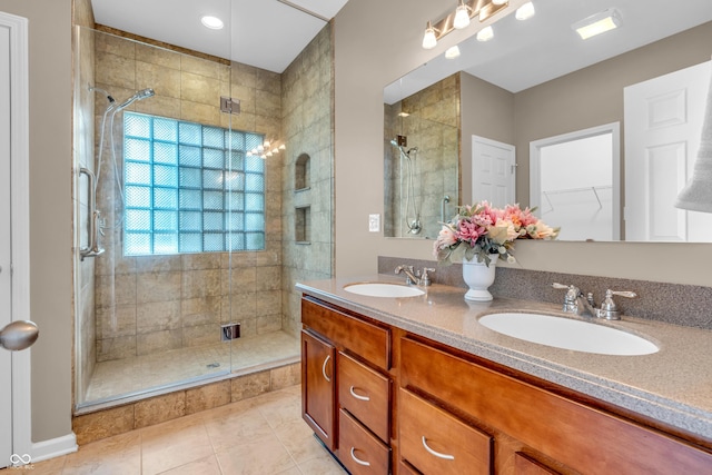 2948 Chalbury Dr, Plainfield, IN 46168 - bathroom featuring a stall shower, double vanity, tile patterned flooring, and a walk in closet