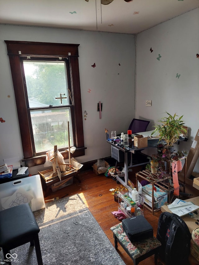 1617 Blaine Ave, Terre Haute, IN 47804 - living room featuring wood finished floors, ceiling fan, and a desk