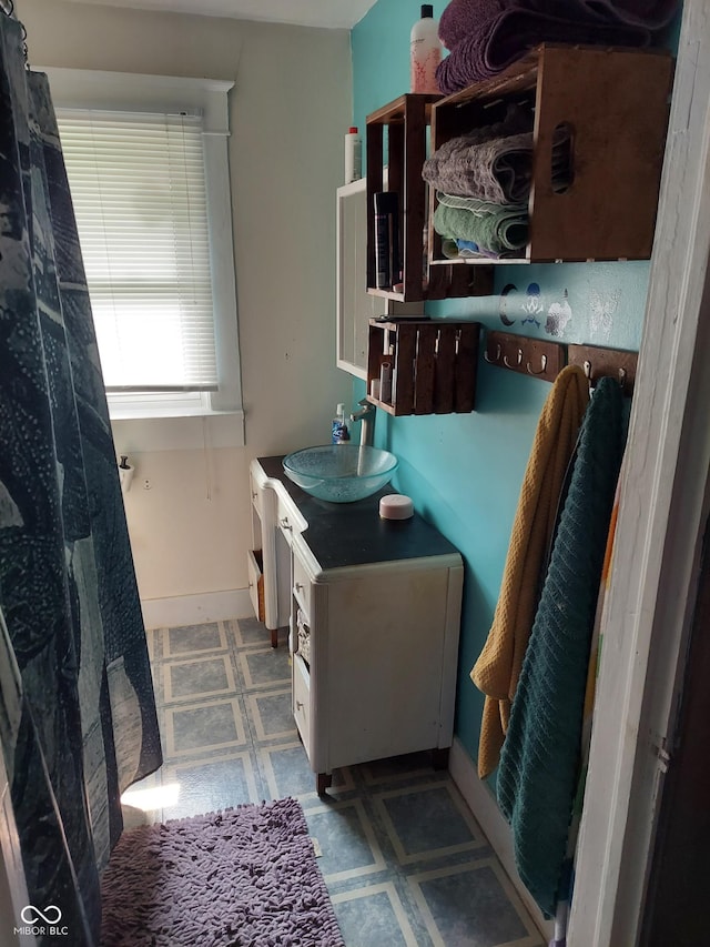 1617 Blaine Ave, Terre Haute, IN 47804 - full bathroom featuring vanity, tile patterned floors, and baseboards