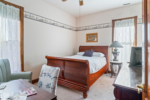 239 E 11th St, Indianapolis, IN 46202 - bedroom featuring carpet flooring and a ceiling fan