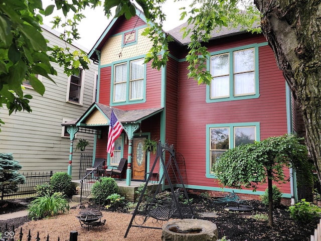 239 E 11th St, Indianapolis, IN 46202 - victorian house with a fire pit and a porch