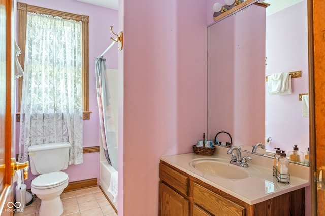 239 E 11th St, Indianapolis, IN 46202 - bathroom with toilet, vanity, tile patterned floors, and shower / bath combo with shower curtain