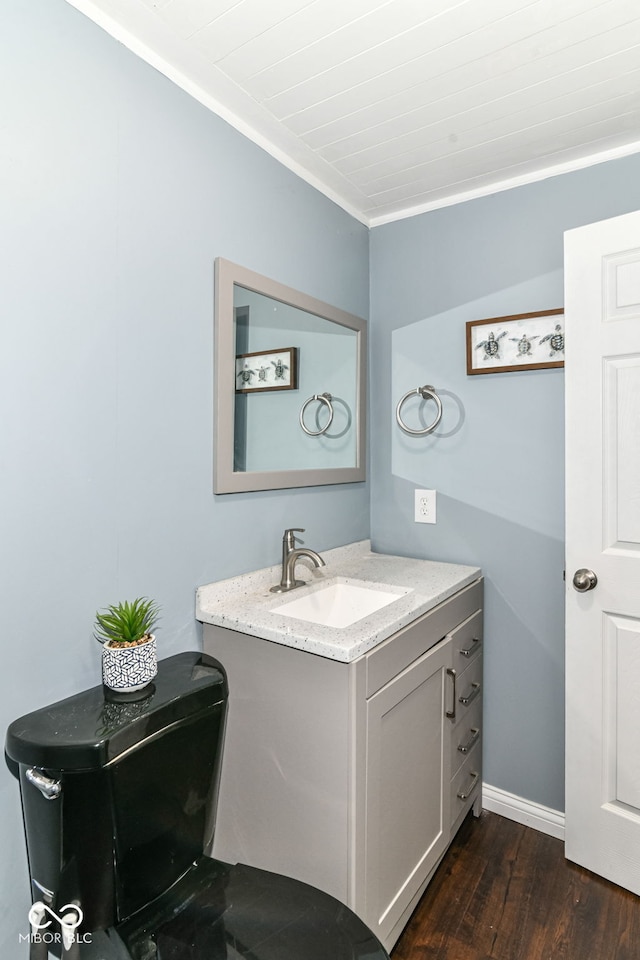 5439 Maywood Dr, Whitestown, IN 46075 - half bath featuring vanity, wood finished floors, crown molding, and baseboards