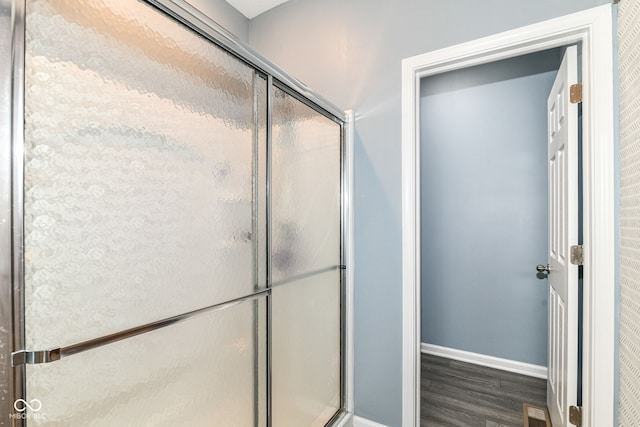 5439 Maywood Dr, Whitestown, IN 46075 - full bathroom with wood finished floors, a stall shower, and baseboards