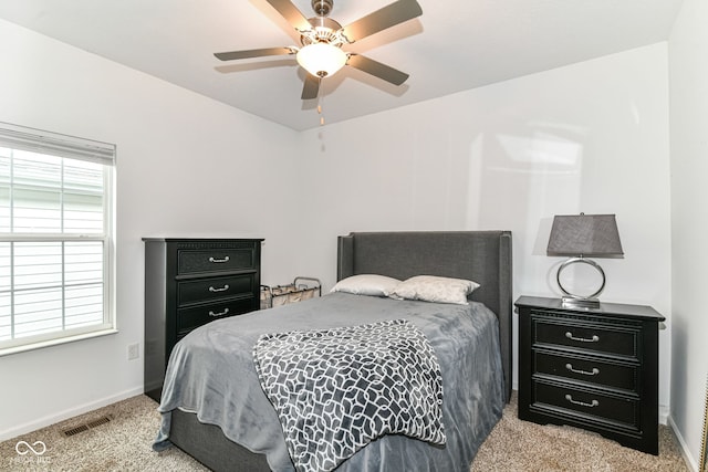 5439 Maywood Dr, Whitestown, IN 46075 - bedroom with light colored carpet, baseboards, and a ceiling fan