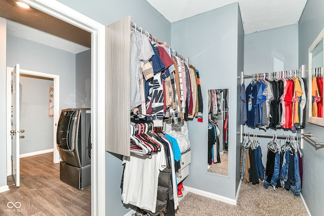 5439 Maywood Dr, Whitestown, IN 46075 - walk in closet with wood finished floors and washer and clothes dryer