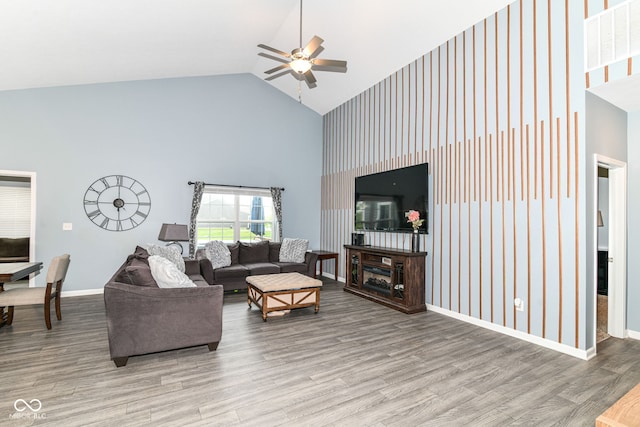 5439 Maywood Dr, Whitestown, IN 46075 - living area with high vaulted ceiling, ceiling fan, wood finished floors, and baseboards