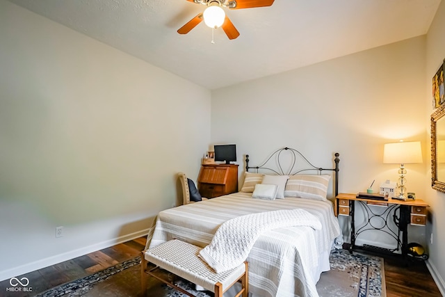 4305 W Coyote Run Ct, Muncie, IN 47304 - bedroom with baseboards, wood finished floors, and ceiling fan