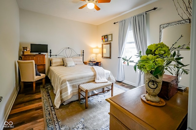 4305 W Coyote Run Ct, Muncie, IN 47304 - bedroom featuring wood finished floors, baseboards, and ceiling fan
