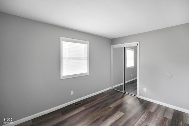 9378 N County Road 75 W, Lizton, IN 46149 - unfurnished bedroom featuring baseboards, dark wood finished floors, and a closet