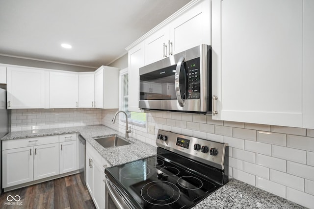 9378 N County Road 75 W, Lizton, IN 46149 - kitchen featuring stainless steel appliances, a sink, white cabinetry, dark wood-style flooring, and recessed lighting