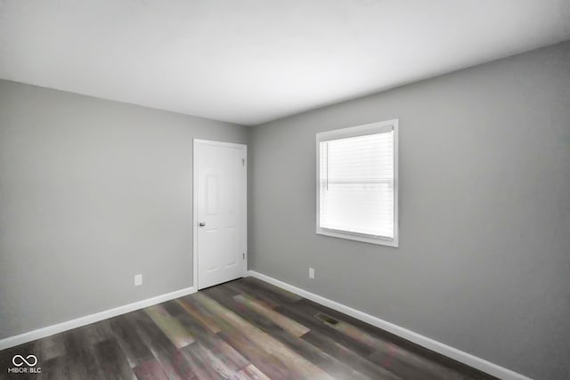 9378 N County Road 75 W, Lizton, IN 46149 - unfurnished room featuring baseboards and dark wood-style flooring