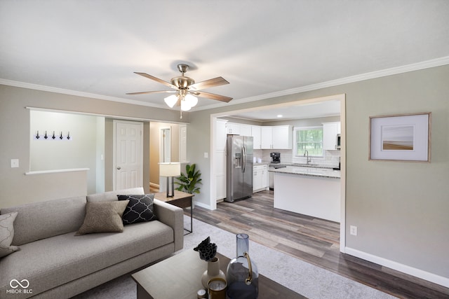 9378 N County Road 75 W, Lizton, IN 46149 - living area featuring dark wood finished floors, crown molding, baseboards, and ceiling fan