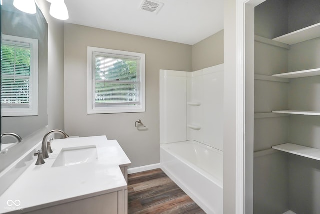 9378 N County Road 75 W, Lizton, IN 46149 - full bathroom with vanity, wood finished floors, shower / tub combination, and baseboards