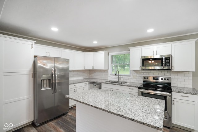 9378 N County Road 75 W, Lizton, IN 46149 - kitchen featuring appliances with stainless steel finishes, a sink, a center island, dark wood finished floors, and white cabinetry