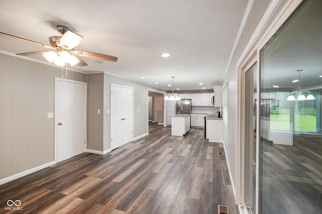 9378 N County Road 75 W, Lizton, IN 46149 - unfurnished living room with dark wood finished floors, recessed lighting, ornamental molding, a ceiling fan, and baseboards