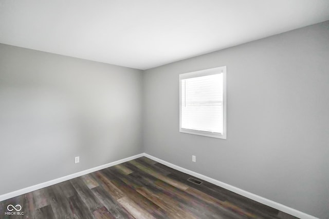 9378 N County Road 75 W, Lizton, IN 46149 - spare room featuring baseboards and dark wood-style floors