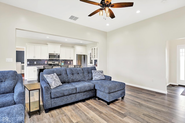 3301 N 200 W, Franklin, IN 46131 - living area featuring washing machine and dryer, ceiling fan, wood finished floors, recessed lighting, and baseboards