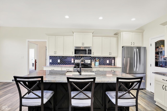 3301 N 200 W, Franklin, IN 46131 - kitchen featuring stainless steel appliances, a sink, backsplash, white cabinetry, and recessed lighting